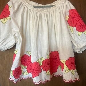 THE GREAT. White smocked blouse with pink florals